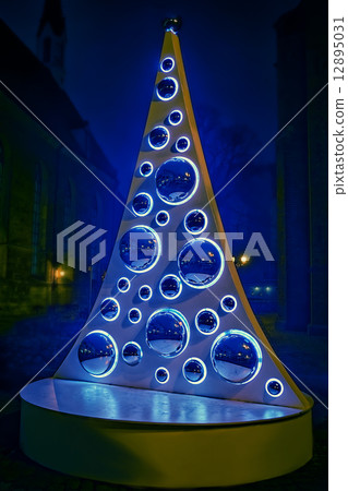Christmas tree art style in night european city street 12895031
