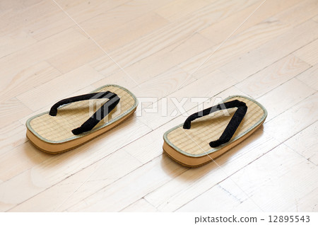 Pair of Traditional Japanese Sandals on Old Wooden Floor. 12895543
