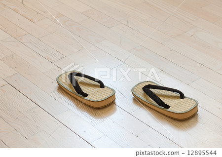 Pair of Traditional Japanese Sandals on Old Wooden Floor. 12895544