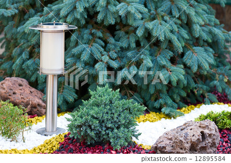 Solar Powered Lamp on Garden Background. 12895584