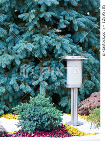 Solar Powered Lamp on Garden Background. 12895585