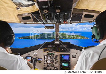 Pilots in the plane cockpit and island Pilots in the plane cockpit and island 12910883