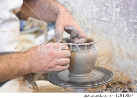 Potter hands and wheel Potter hands and wheel 12910884