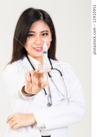 Asian female doctor preparing a syringe for injection 12910952