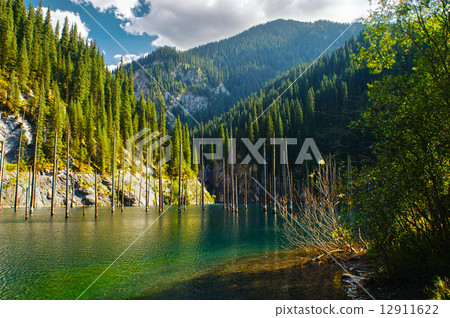 Kaindy Lake in Tien Shan mountain, Kazakhstan. Autumn Kaindy Lake in Tien Shan mountain, Kazakhstan. Autumn 12911622