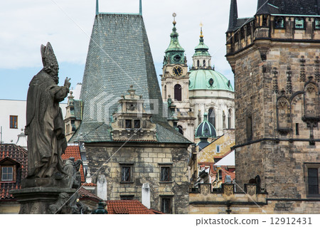 Saint Nicholas church and town bridge tower in Prague 12912431