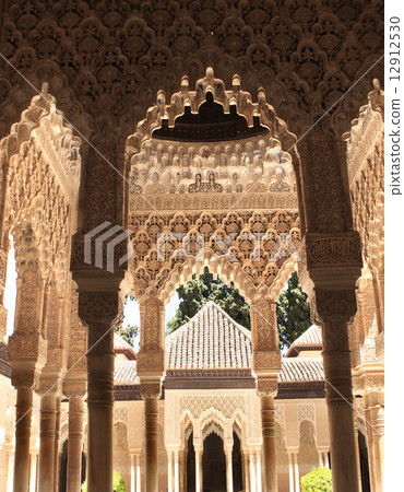 Ancient carved ornament on columns in Alhambra, Spain Ancient carved ornament on columns in Alhambra, Spain 12912530