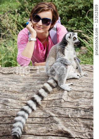 Ring-tailed lemur and young caucasian woman 12912809