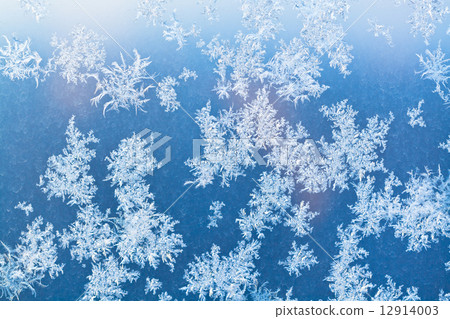 sunbeam spots and frosty pattern on window pane 12914003