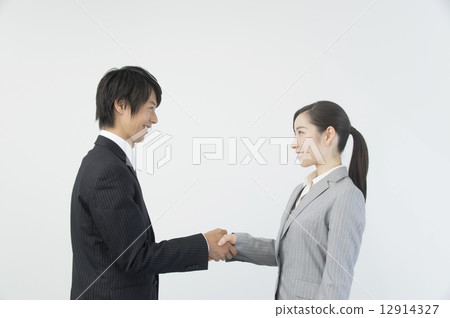 握手的商人和女實業家 握手的商人和女實業家 12914327