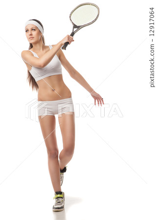 Young woman playing tennis Isolated on white Young woman playing tennis Isolated on white 12917064
