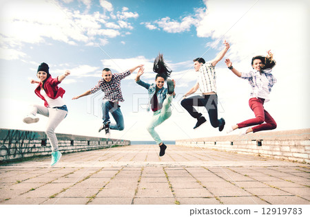 group of teenagers jumping group of teenagers jumping 12919783