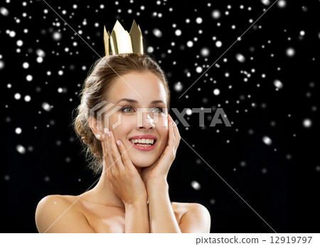 smiling woman in evening dress wearing crown 12919797