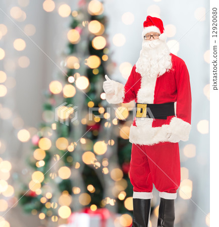 man in costume of santa claus showing thumbs up 12920080