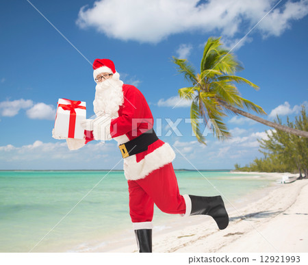 man in costume of santa claus with gift box man in costume of santa claus with gift box 12921993