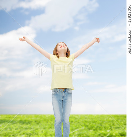 smiling teenage girl with raised hands smiling teenage girl with raised hands 12922056