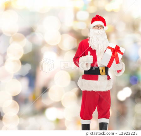 man in costume of santa claus with gift box man in costume of santa claus with gift box 12922225