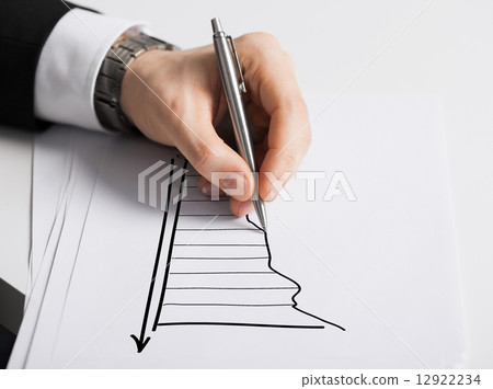 close up of male hand with pen drawing graph close up of male hand with pen drawing graph 12922234