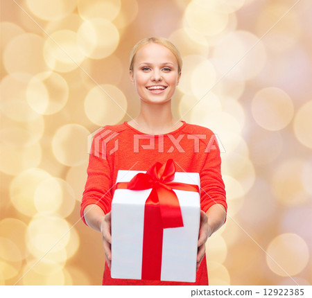 smiling woman in red clothes with gift box smiling woman in red clothes with gift box 12922385
