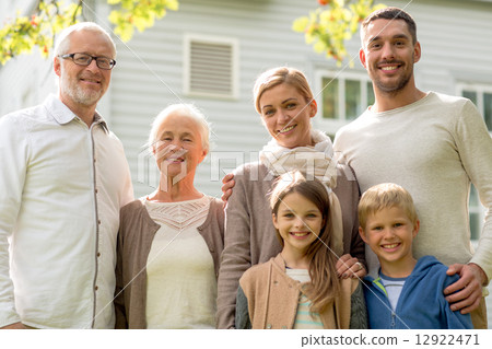 happy family in front of house outdoors 12922471