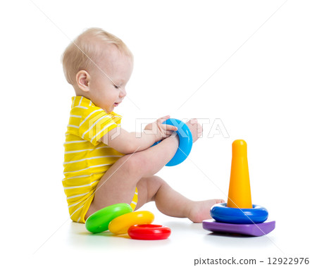 funny baby boy playing with colorful toy funny baby boy playing with colorful toy 12922976