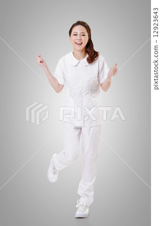 Cheerful Asian nurse Cheerful Asian nurse 12923643