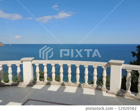White classic balustrade on the background of the Black sea in Crimea 12926562