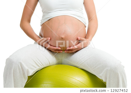 Pregnant woman excercises with gymnastic ball 12927452