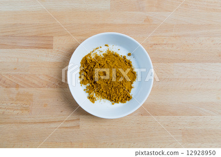 Curry in a bowl on wood 12928950