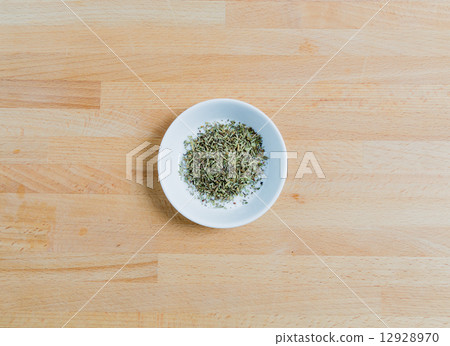 Provencal herbs in a bowl on wood 12928970