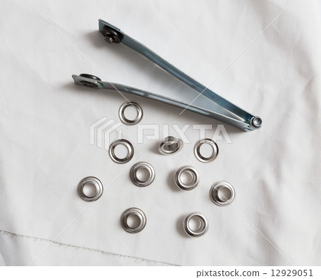 Rivets on light white cloth 12929051