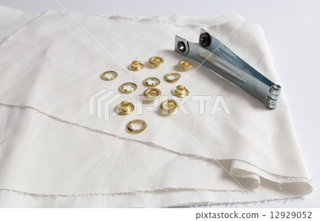 Rivets on light white cloth 12929052