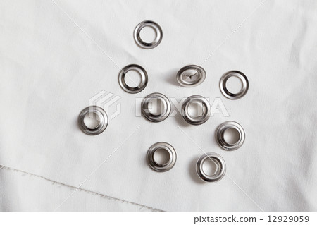 Rivets on light white cloth 12929059
