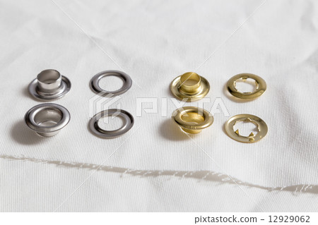 Rivets on light white cloth 12929062