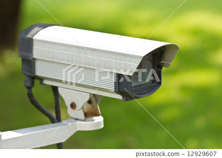 Close up of security surveillance camera isolated on green backg Close up of security surveillance camera isolated on green backg 12929607