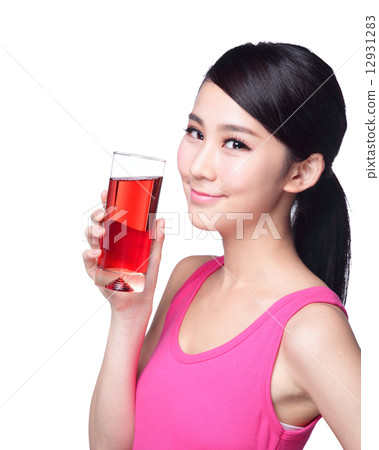 Young happy woman drink juice Young happy woman drink juice 12931283