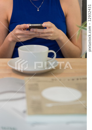 Woman texting Woman texting 12932431