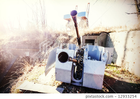 Retro filtered photo of a antiaircraft gun muzzle. Retro filtered photo of a antiaircraft gun muzzle. 12933254