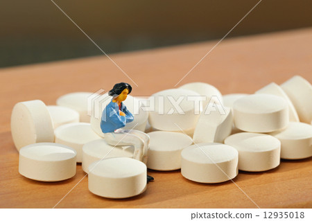 Pill and woman 12935018