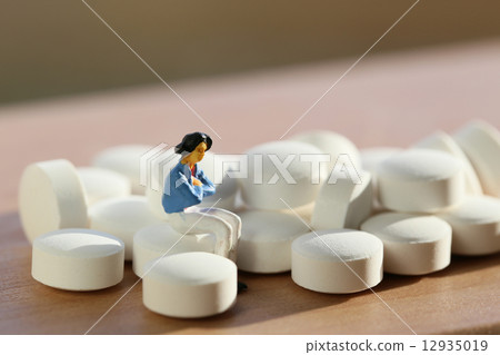 Pill and woman 12935019