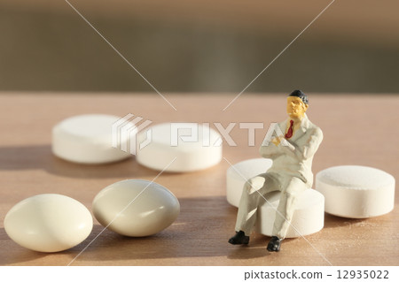 Pill and man 12935022