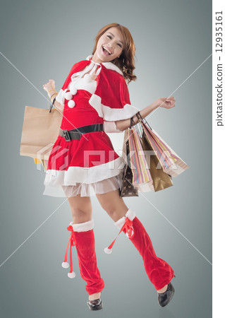 Asian Christmas girl hold shopping bags 12935161