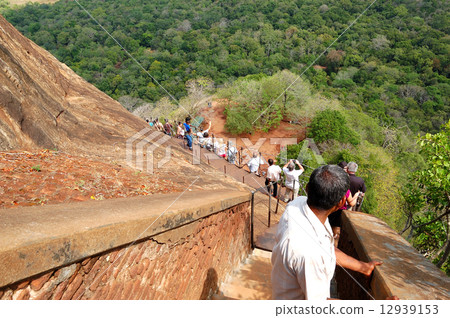 The tourist walking down  from Sigiriya (Lion's rock) 12939153