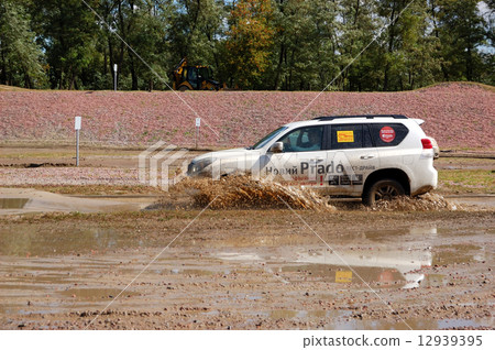 New generation of Toyota Prado during off-road test- drive at Yearly automotive-show New generation of Toyota Prado during off-road test- drive at Yearly automotive-show 12939395