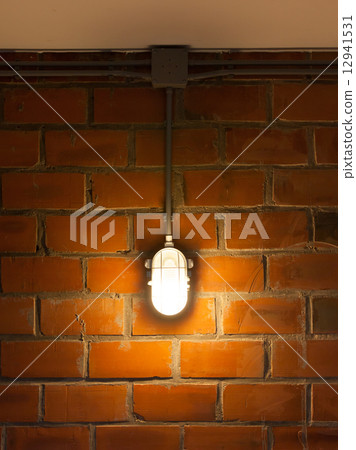 Old brick wall with industrial light 12941531