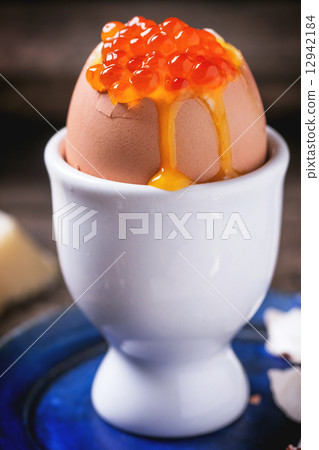 Soft-boiled egg with red caviar Soft-boiled egg with red caviar 12942184