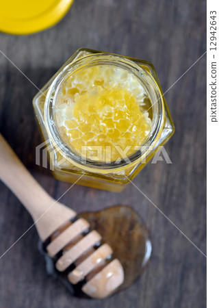 honeycomb and honey in glass jars honeycomb and honey in glass jars 12942643