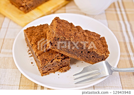 Pie chocolate in plate with fork on tablecloth 12943948