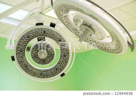 Two turned off surgical lamps in operation surgery room. 12944836