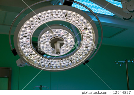 Surgical lamp in operation surgery room. Half brightness. 12944837